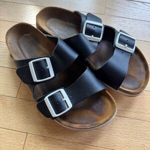 Arizona Birkenstock on matte black with white buckle and sole